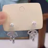 Nuevos Pendientes Populares de Encaje Hueco con Lazo y Perlas para Mujer, Exquisitos, Ligeros y Lujosos, Pendientes de Diseño Versátil