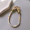 Pulsera de Muñeca de Color Caramelo de Moda Pulsera Corta de Perlas Redondas con Diamantes Venta Caliente Transfronteriza Correa de Mano Antiperdida y Anticaída Estilo Caliente