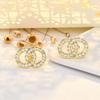 Pendientes de plata 925 con forma de aguja y letras, con un toque de sentido avanzado, elegantes pendientes de circonita coreana para celebridades de Internet, chapados en oro exquisitos para preservar el color.