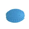 Venta al por mayor de fábrica juguetes para perros pelota de granada de rugby TPR limpieza de dientes juguetes interactivos con sonido suministros para mascotas