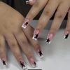 24 uñas postizas francesas con forma de almendra y adornos de estrellas y diamantes de imitación.