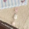 Llavero de conejo estilo japonés y estrellita, suave y lindo, femenino, estrella de cinco puntas color crema, colgante de mochila de dibujos animados, regalo para mejores amigas