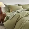 Conjunto de cama de quatro peças de algodão de fibra longa escovado para outono e inverno, com padrão jacquard tecido em cores e uma capa de edredom espessa estilo japonês