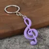 Nuevo llavero de metal con nota musical personalizada estilo dopamina, colgante pequeño promocional, colgante de cadena para llavero con símbolo musical