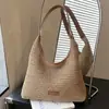 Bolso de paja de gran capacidad transfronterizo para mujer, nuevo bolso tejido a mano de verano 2026, bolso de hombro para debajo del brazo para mujer