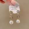 Pendientes de Perla de Circonita de Moda de Aguja Plateada Pendientes de Botón Retro de Lujo Ligero de Nicho Francés Pendientes Nuevos 2026