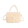 Bolso Tejido Transfronterizo para Niños 2026 Otoño/Invierno Nuevo Moda Hueco Bolso de Playa Estilo Pequeño Chanel Bolso de Mano con Perlas Bolso de Hombro