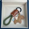 Moda de celebridade da internet corda trançada de couro agora mesmo chaveiro rico chaveiro de carro fofo de desenho animado pacote pingente atacado