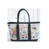 Bolso Cubo Versátil Estilo Cesta Modelo Nuevo 2025 Bolso de Mano Versátil con Graffiti Bolso de Hombro Bolso Cruzado de Nicho para el Día a Día