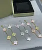 Transmisión en vivo estilo popular V dorado versión alta pulsera de trébol de cuatro hojas para mujer lujo ligero moda versátil chapada en 18k ágata nácar pulsera de cinco pétalos
