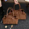 Bolsa de mano transfronteriza de gran capacidad, estilo nicho vintage, gamuza mate, ideal para el trabajo, versátil, tacto de alta gama, bolsa de mano de un solo hombro