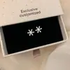 Conjunto de Brincos Super Brilhantes de Zircônia Leve de Luxo com Design Elegante de Floco de Neve e Rena Estrela de Cinco Pontas Exquisitos Brincos Venda por Atacado