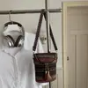 Bolsa estilo étnico nova bolsa transversal bolsa feminina sensação de alta qualidade temperamento bolsa com franja alça colorida bolsa de ombro único feminina