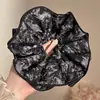 Estilo perezoso 2026 nuevo coletero de oso con pompón y diseño floral, accesorio para el cabello retro y de alta gama para mujeres