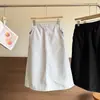 Nuevo estilo de principios de otoño, forro polar cálido, cortavientos, línea A, falda larga blanca versátil para ir al trabajo 13405