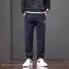 Spot de fábrica novo calças de outono/inverno 2025 espessura média masculinas soltas retas espessadas calças esportivas casuais calças compridas yang