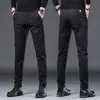 Calça Casual Escovada de Alta Qualidade de Hong Kong Masculina Versátil para Negócios 2026 Forrada com Fleece Engrossada Slim Fit Barra Afunilada Calça Masculina Estilo Coreano