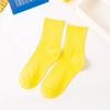 Venta directa de fábrica de calcetines de primavera con explosiones de colores sólidos japoneses de color caramelo para mujer, calcetines de colores de marea, venta al por mayor