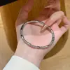 Pulsera de bambú redonda y brillante, superventas transfronteriza, no se decolora, para mujer, diseño de lujo ligero con cierre ovalado, joyería de acero de titanio