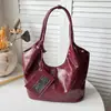 Bolso nuevo de principios de otoño 2026, bolso cubo liso vintage, bolso de mano simple, bolso de hombro a la axila moderno y relajado