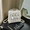 Mochila de estilo coreano para mujer con lazo, moda de principios de primavera, versátil, moderna, linda, casual, bolso de mano para el día a día