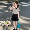 Conjunto Casual de Verão para Meninas 2026 Novo Estilo Coreano Elegante Camisa Polo Fina de Manga Curta e Shorts Conjunto de Duas Peças