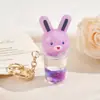 Chaveiro Criativo de Coelho Brilhante com Areia Líquida Pingente de Desenho Animado em Acrílico Acessório para Carro Mochila Presente Fofo para Meninas