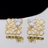 Pendientes de lujo con forma de corazón de circonita cuadrada hueca para mujer, ligeros y europeos y americanos, con aguja de plata s925, estilo celebridad, a la moda.