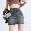 Falda Corta de Mezclilla Estilo Retro Americano para Mujer Verano 2025 Nueva Anti-Exposición Sexy de Cintura Alta que Cubre la Cadera Falda de Línea A