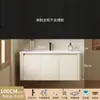 Tocador de baño engrosado y ahorrador de espacio con diseño en color crema, que cuenta con un lavabo redondeado, lavabo cerámico integrado y un lavabo de una sola pieza.