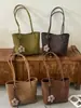 Bolsa casual estilosa de grande capacidade 2026 novo modelo bolsa de ombro casual bolsa de axila padrão trançado bolsa sacola para o dia a dia