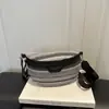 Bolso tejido bicolor para mujer 2026 nuevo modelo casual versátil riñonera de moda texturizado casual simple para viaje bandolera