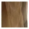 Color camello amarillo ligeramente moteado retro desgastado fino transparente textura de malla tela de organza teñido anudado falda tela para ropa