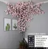 Ramas de flor de cerezo flor de durazno falsa plantas verdes de techo decoración enredaderas de flores de interior pared de celebridad de internet supermercado restaurante habitación cubierta superior fealdad