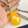 Collar con colgante de gota de agua de cera de abeja antigua optimizado 2025 Nuevo popular largo nicho ámbar cadena de suéter para mujer