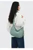 Bolsa transversal feminina em formato de dumpling, bolsa de grande capacidade para o dia a dia, novo design de veludo cotelê 2026, simples e casual, bolsa de ombro versátil