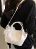Bolso pequeño simple y elegante para mujer, nuevo bolso tipo cubo verano 2026, bolso cruzado de color sólido texturizado de moda para mujer