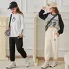 Pantalones deportivos para niños con forro polar engrosado otoño e invierno nueva ropa infantil sueltos con cordón en el tobillo Pantalones casuales para niñas en vivo caliente
