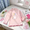 En StockBlusa Base para Niña 2026 Primavera/Otoño Nuevo Estilo Coreano Volante Linda Manga Larga Top para Niña Pequeña