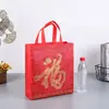 Bolsa de regalo de Año Nuevo, bolsa de regalo festiva de Año Nuevo, bolsa de mano de tela no tejida roja para cigarrillos, vino, té, bolsa para banquetes, hecha a medida