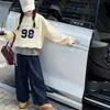 Nueva colección de otoño para niñas: conjunto de sudadera con dobladillo a rayas asimétrico y pantalones vaqueros de pierna ancha