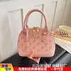 Popular bolsa europea y americana vintage de concha floral, bolso de mano versátil de alta gama, moda transfronteriza 2026, bolso de hombro, bolso cruzado para mujer