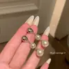 Pendientes de perla color café 2026 nuevos populares de alta gama con sentido de diseño para mujer accesorios de pendientes de moda de nicho de lujo ligero
