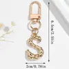 Llavero de aleación de venta caliente en Amazon transfronterizo, nuevo, con alfabeto de 26 letras, colgante creativo, accesorio para bolso, decoración