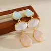 Pendientes de resina de colores irregulares con forma de gota de agua transfronterizos europeos y americanos, pendientes de estilo nicho para vacaciones, pendientes de lujo ligero de alta gama para mujer