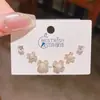 Verano nuevo chapado en oro real exquisitos tres pares de aretes pequeños de alto sentido pequeños frescos dulces aretes de temperamento combinables