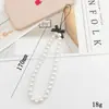 Cadena para teléfono de perlas estilo Chanel Colgante de flor pequeña Cordón para teléfono Funda para teléfono Accesorio con cuentas Cadena anticaídas para mujer