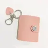 Álbum de fotos de 1 pulgada 2 pulgadas para venta al por mayor, álbum de fotos de identificación, libro de almacenamiento de estrellas, mini álbum de fotos de cuero macarrón