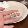 Pendientes de perlas con lazo de colores para mujer. Pendientes exclusivos de alta gama. Nuevos pendientes de estilo dulce y fresco para el verano de 2025.