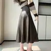 Foto real de falda de cuero PU de alta gama para mujer, falda midi de línea A de otoño, nuevo modelo 2026 falda larga, falda de paraguas, falda de longitud media